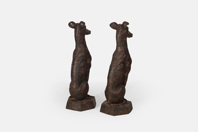 Lot A pair of patinated cast iron whippets