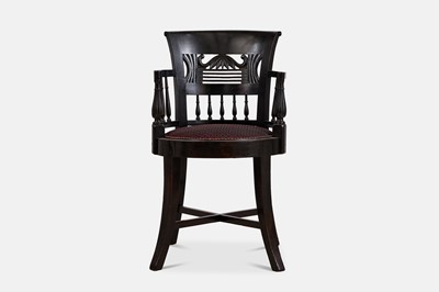 Lot 297 - An ebonised hardwood armchair