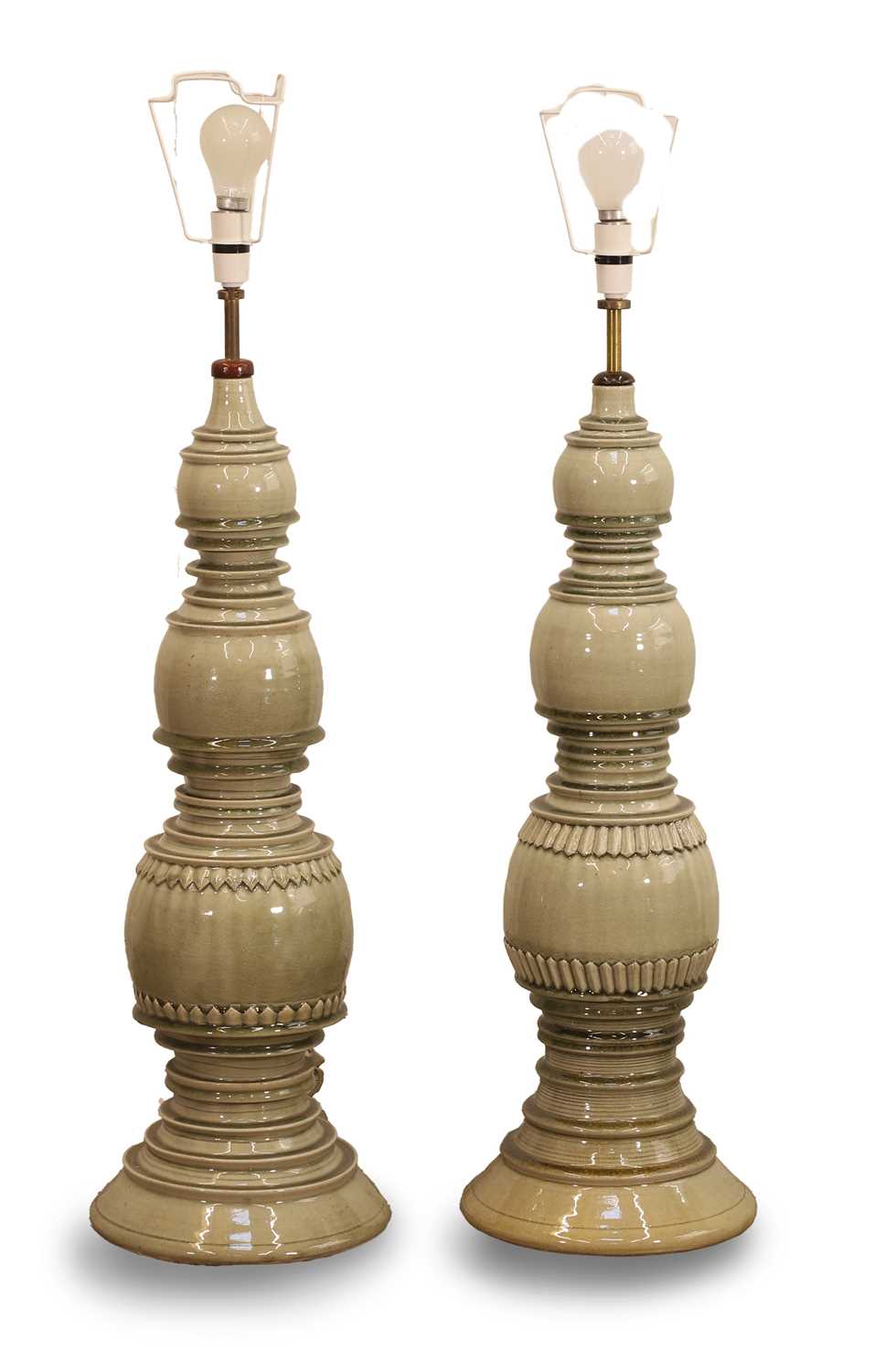 Lot 476 - Two Asian style green glazed lamps