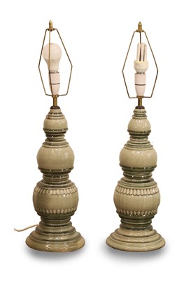 Lot 471 - A pair of small Asian style green glazed lamps
