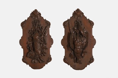 Lot 142 - Two Black Forest carved wall sculptures
