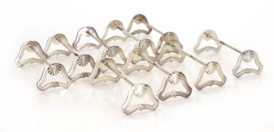 Lot 41 - A set of nine silver knife rests