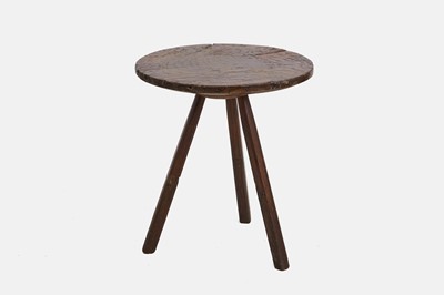 Lot 237 - A primitive elm cheese-top cricket table
