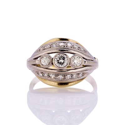 Lot 77 - A three stone diamond bombé ring