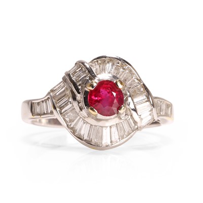 Lot 85 - A ruby and diamond crossover design ring