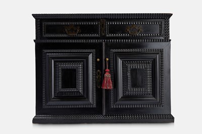 Lot 128 - A baroque ebonised fruitwood cabinet