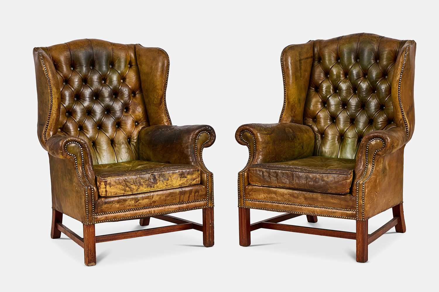 Lot 253 - A pair of Victorian-style leather wing armchairs