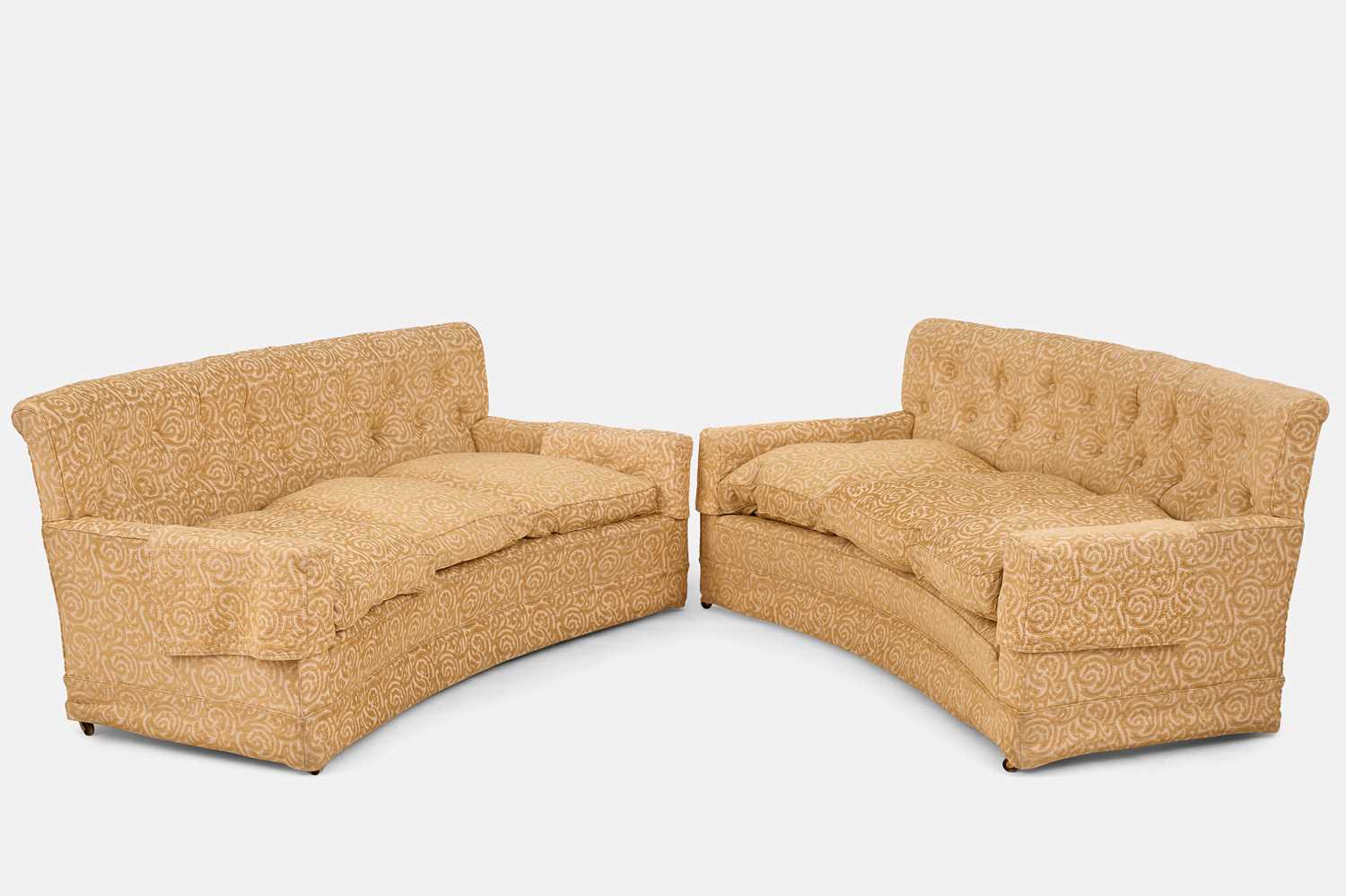 Lot 360 - A pair of button-upholstered sofas by Howard & Sons