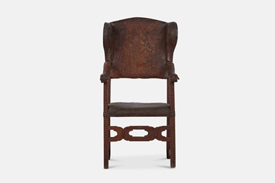 Lot 249 - A walnut-framed leather wing armchair
