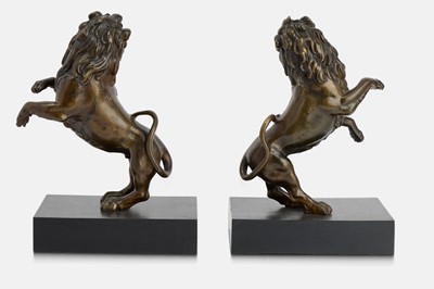Lot 78 - A pair of bronze lion rampant sculptures