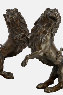 Lot 78 - A pair of bronze lion rampant sculptures