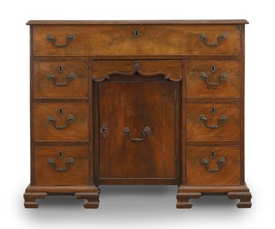 Lot 511 - A George III mahogany kneehole desk