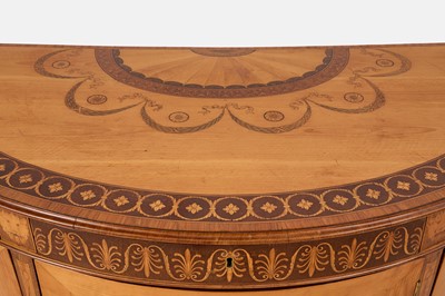 Lot A George III satinwood, harewood and marquetry commode attributed to Ince & Mayhew