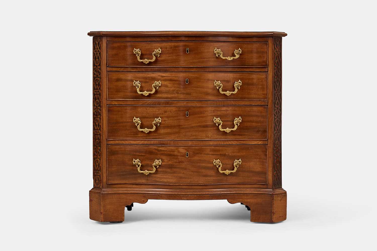 Lot 3 - A George III mahogany serpentine chest of drawers