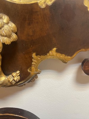 Lot 20 - A George II walnut and parcel-gilt mirror