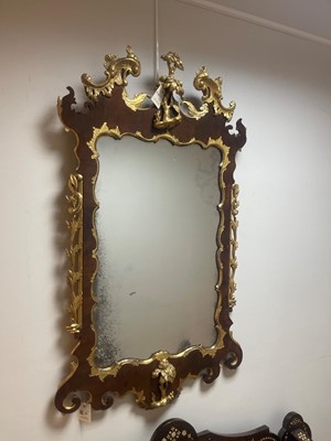 Lot 20 - A George II walnut and parcel-gilt mirror