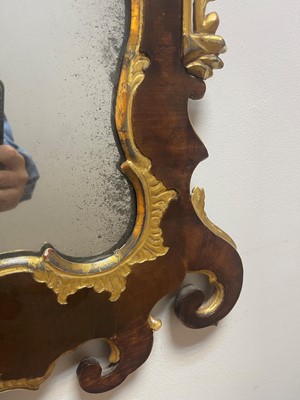Lot 20 - A George II walnut and parcel-gilt mirror