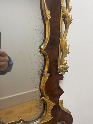 Lot 20 - A George II walnut and parcel-gilt mirror