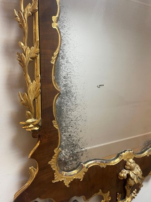 Lot 20 - A George II walnut and parcel-gilt mirror