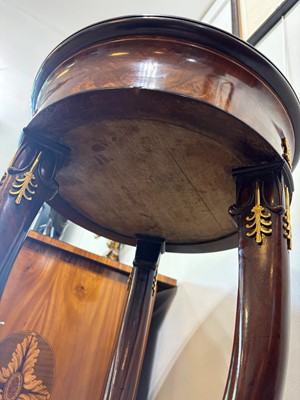 Lot 44 - A pair of mahogany, porphyry and ormolu torchères
