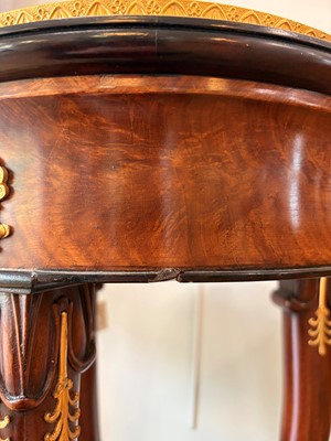 Lot 44 - A pair of mahogany, porphyry and ormolu torchères