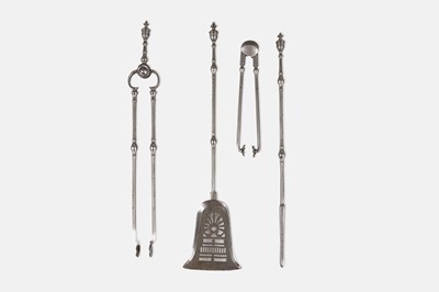 Lot 51 - A George III polished steel and iron fire set