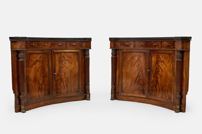 Lot 30 - A pair of Regency mahogany corner cabinets