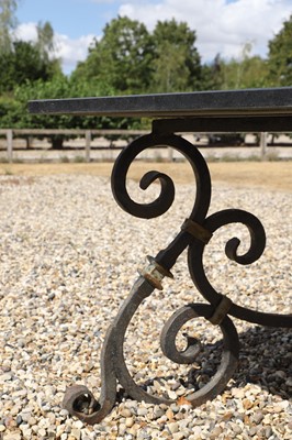 Lot 422 - A wrought-iron-framed garden table