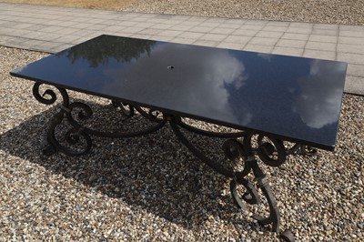 Lot 422 - A wrought-iron-framed garden table