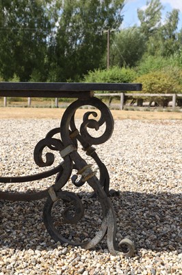 Lot 422 - A wrought-iron-framed garden table