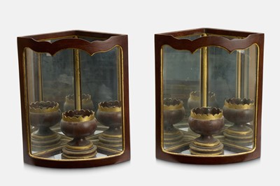 Lot 233 - A pair of George II-style painted metal and glass wall lanterns by Colefax & Fowler
