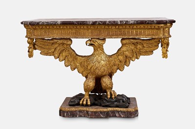Lot A pair of George II-style carved giltwood eagle console tables
