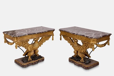 Lot A pair of George II-style carved giltwood eagle console tables