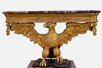 Lot A pair of George II-style carved giltwood eagle console tables