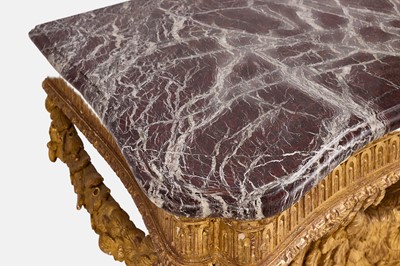 Lot A pair of George II-style carved giltwood eagle console tables