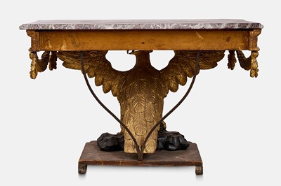 Lot A pair of George II-style carved giltwood eagle console tables