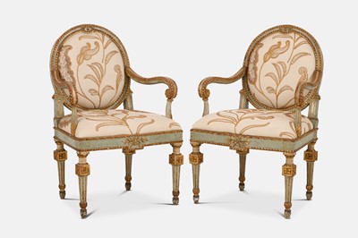 Lot 352 - A pair of Louis XVI-style painted and parcel-gilt wooden armchairs