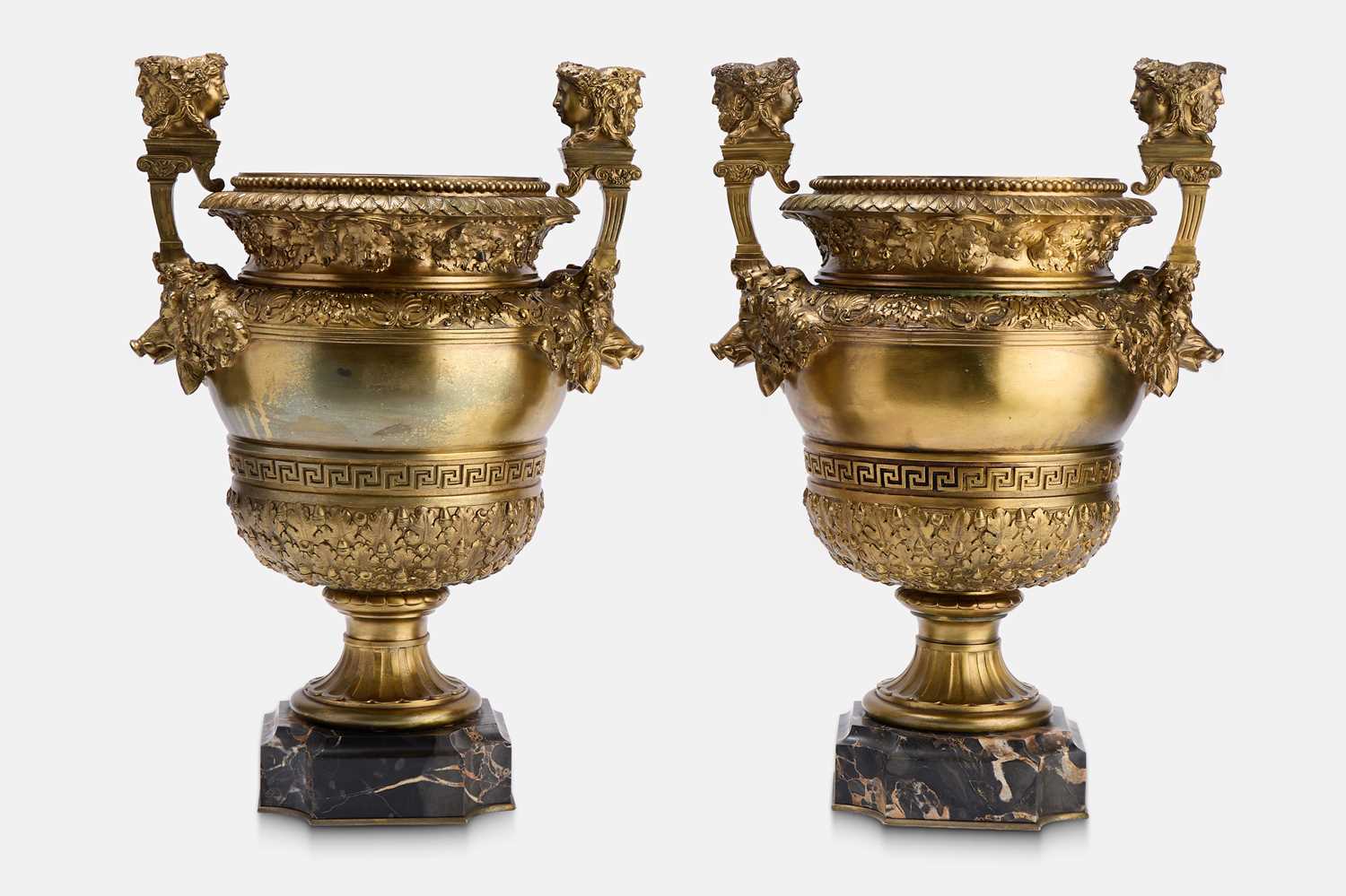 Lot 88 - A pair of neoclassical gilt-bronze urns