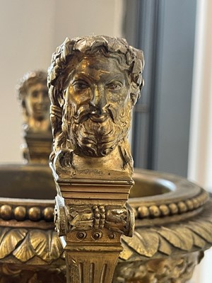 Lot 88 - A pair of neoclassical gilt-bronze urns
