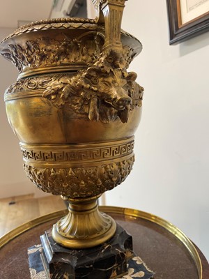 Lot 88 - A pair of neoclassical gilt-bronze urns