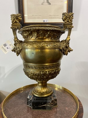 Lot 88 - A pair of neoclassical gilt-bronze urns