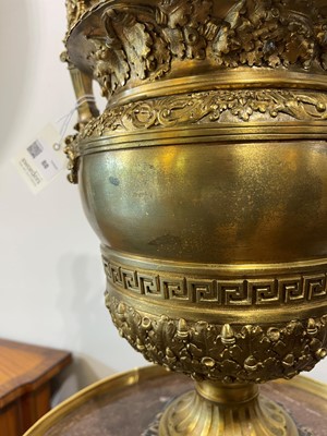 Lot 88 - A pair of neoclassical gilt-bronze urns