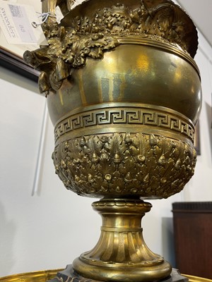 Lot 88 - A pair of neoclassical gilt-bronze urns