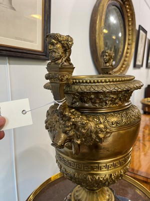 Lot 88 - A pair of neoclassical gilt-bronze urns
