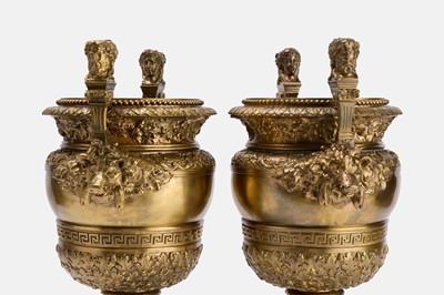 Lot 88 - A pair of neoclassical gilt-bronze urns