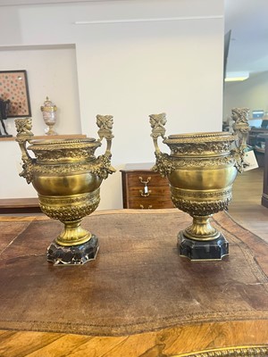 Lot 88 - A pair of neoclassical gilt-bronze urns