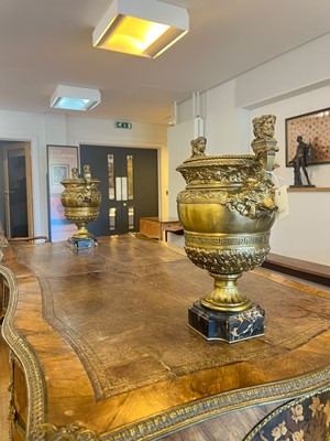 Lot 88 - A pair of neoclassical gilt-bronze urns