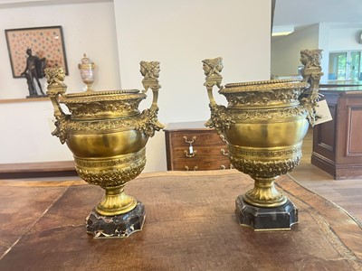 Lot 88 - A pair of neoclassical gilt-bronze urns