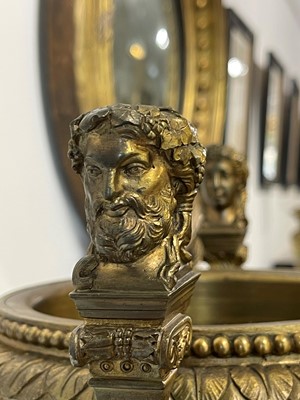 Lot 88 - A pair of neoclassical gilt-bronze urns