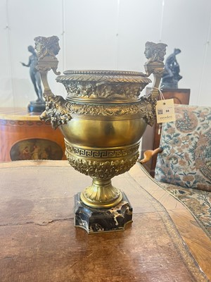 Lot 88 - A pair of neoclassical gilt-bronze urns